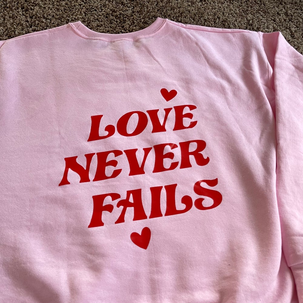 Love Never Fails Crewneck